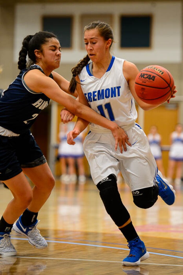 (Trent Nelson | The Salt Lake Tribune)  Fremont's Karlie Valdez (11) drives on Hunter's Lavi Laloni (22) as Hunter faces Fremont in the 6A High School Girls' Basketball Tournament at SLCC in Taylorsville, Tuesday Feb. 20, 2018.