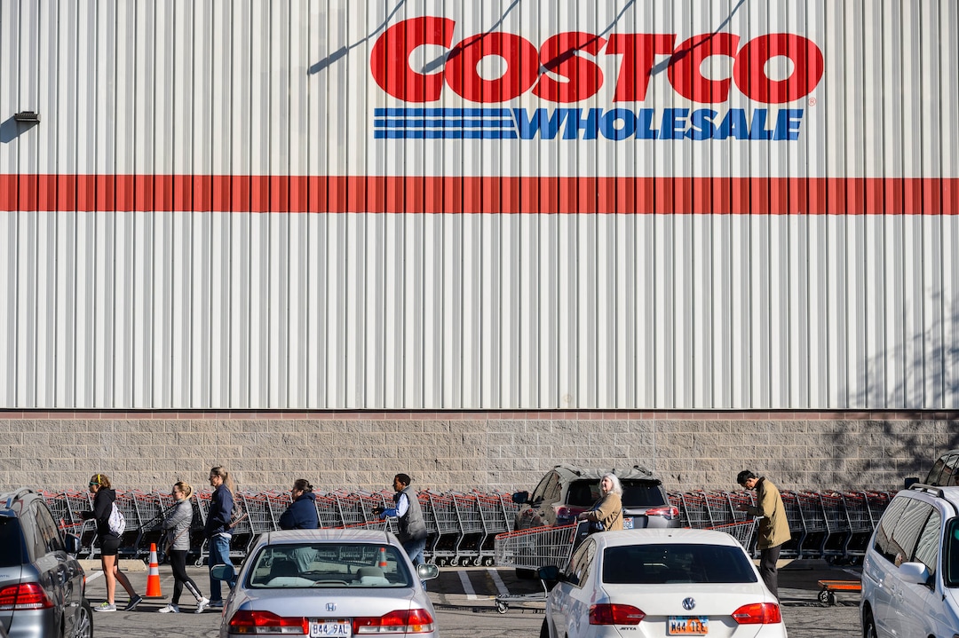 (Trent Nelson  |  The Salt Lake Tribune) Shoppers spaced out in line at the Salt Lake City Costco location on Monday, March 16, 2020.