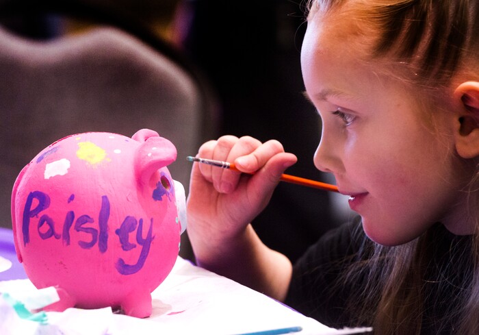 (Rick Egan  |  The Salt Lake Tribune)   Paisley Hunker, 5 1/2 years-old from Lehi, paints a pig for the With Heart Foundation at the Salt Lake Tribune Home & Garden show, at the Mountain America Expo Center in Sandy, Saturday, March 10, 2018.