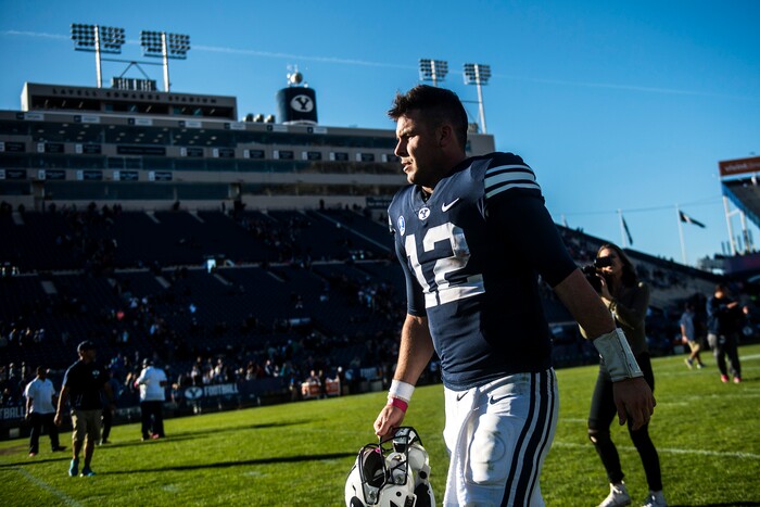 (Chris Detrick  |  The Salt Lake Tribune)  Brigham Young Cougars quarterback Tanner Mangum (12) walks off of the field after the game at LaVell Edwards Stadium Saturday, October 28, 2017.  Brigham Young Cougars defeated San Jose State Spartan 41-20.