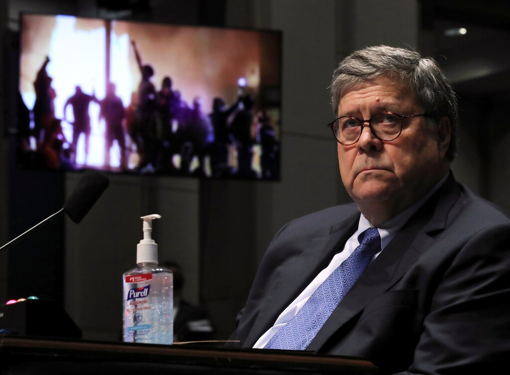 (Chip Somodevilla | Pool via AP) Attorney General William Barr listens during a House Judiciary Committee hearing on the oversight of the Department of Justice as a video plays in the background on Capitol Hill, Tuesday, July 28, 2020 in Washington.