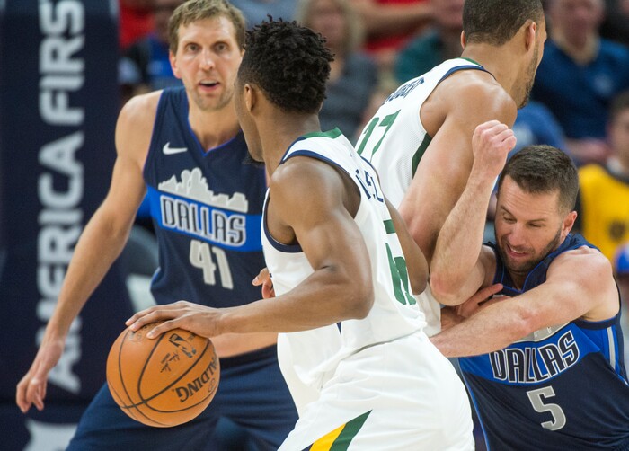 (Rick Egan  |  The Salt Lake Tribune)    Utah Jazz guard Donovan Mitchell (45) gets past Dallas Mavericks guard J.J. Barea (5) as Utah Jazz center Rudy Gobert (27) sets a screen, in NBA action between Utah Jazz and Dallas Mavericks in Salt Lake City, Saturday, Feb. 24, 2018.