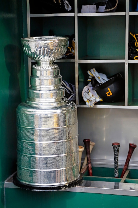 The Stanley Cup sits on the bat rack in the Pittsburgh Pirates dugout during a celebration of the Pittsburgh Penguins Stanley Cup win over the Nashville Predators before a baseball game between the Pittsburgh Pirates and the Colorado Rockies in Pittsburgh, Tuesday, June 13, 2017. (AP Photo/Gene J. Puskar)