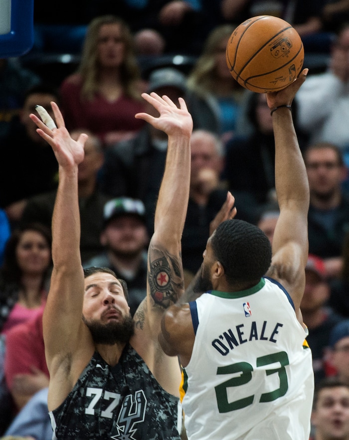 (Rick Egan  |  The Salt Lake Tribune)  Utah Jazz forward Royce O'Neale (23) shoots over San Antonio Spurs center Joffrey Lauvergne (77), in NBA action Utah Jazz vs San Antonio Spurs in Salt Lake City, Monday, February 12, 2018.