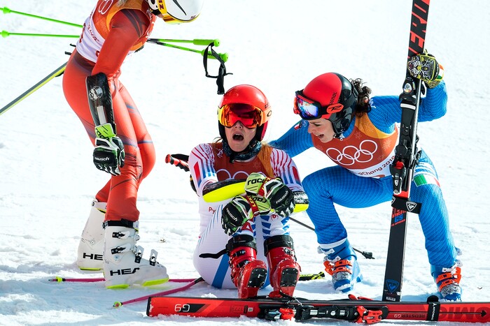 (Chris Detrick  |  The Salt Lake Tribune)  Italy's Federica Brignone, right, and Norway's Ragnhild Mowinckel, left, comfort USA's Mikaela Shiffrin as she realizes she has won the gold in the Ladies' Giant Slalom at Yongpyong Alpine Centre during the Pyeongchang 2018 Winter Olympics Thursday, Feb. 15, 2018.  Shiffrin won the event with a time of 2:20.02. Mowinckel won silver and Brignone won bronze. 
