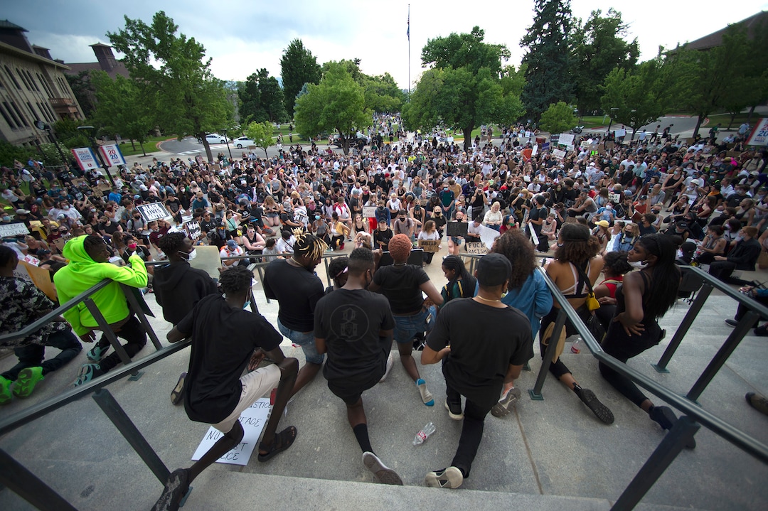 (Rick Egan  |  The Salt Lake Tribune)    Protesters take a knee in front of the Park Building at the University of Utah, during a demonstration,  Wednesday, June 3, 2020.