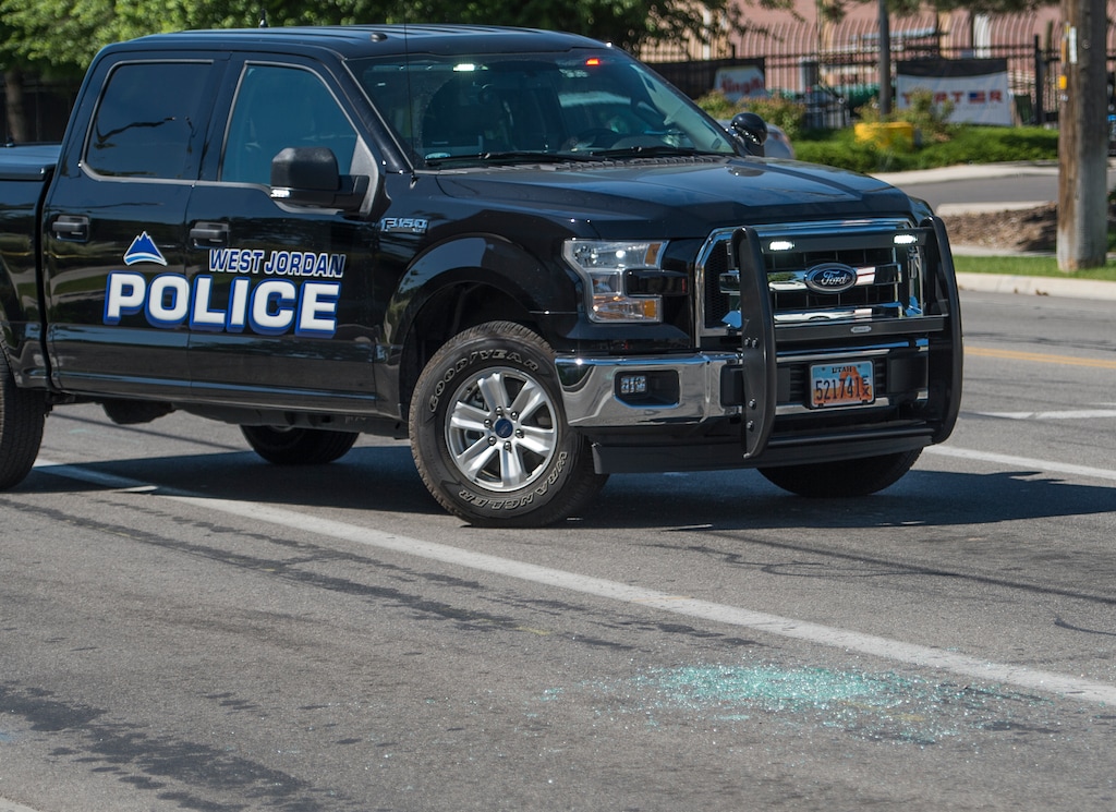 (Leah Hogsten | The Salt Lake Tribune) A West Jordan police vehicle at a crime scene in 2017. A father and his adult son were found fatally shot in their West Jordan home on Monday, Oct. 3, 2022, and police are investigating their deaths as an apparent murder-suicide.