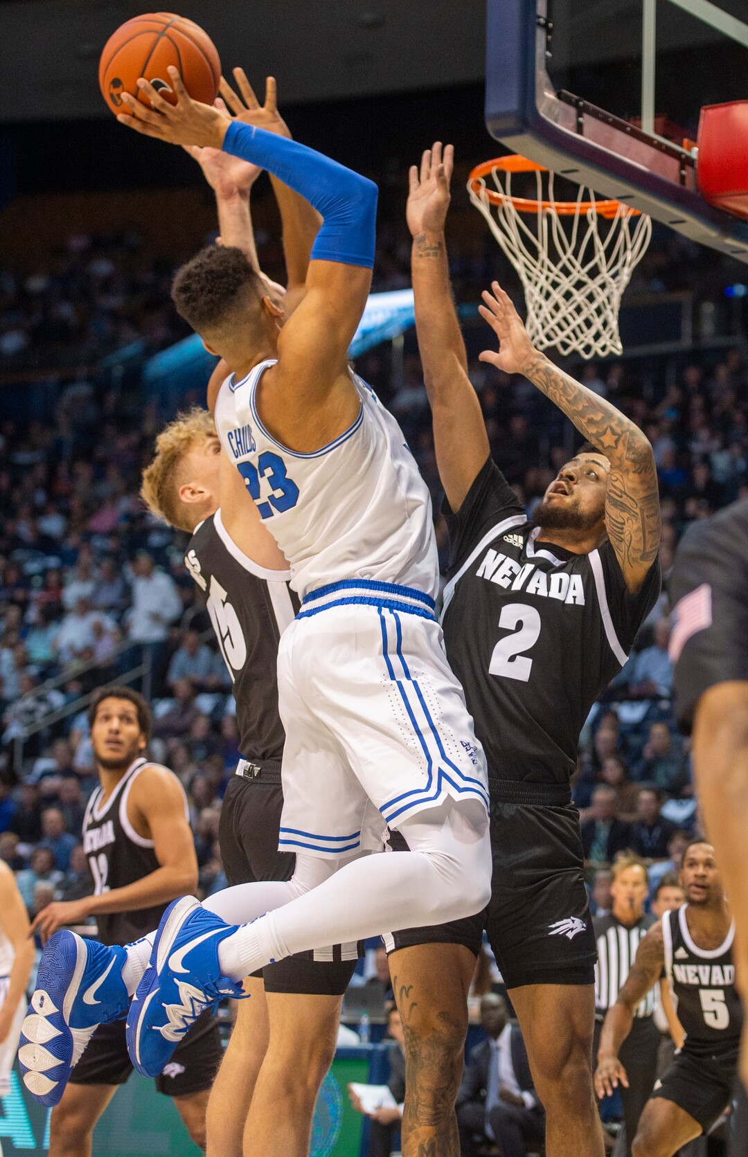 (Rick Egan  |  The Salt Lake Tribune)       Brigham Young Cougars forward Yoeli Childs (23) takes the ball to the hoop, as Nevada Wolf Pack guard Jalen Harris (2) defends, in basketball action between the Brigham Young Cougars and the Nevada Wolf Pack, at the Marriott Center, in Provo, Saturday, December 10, 2019.