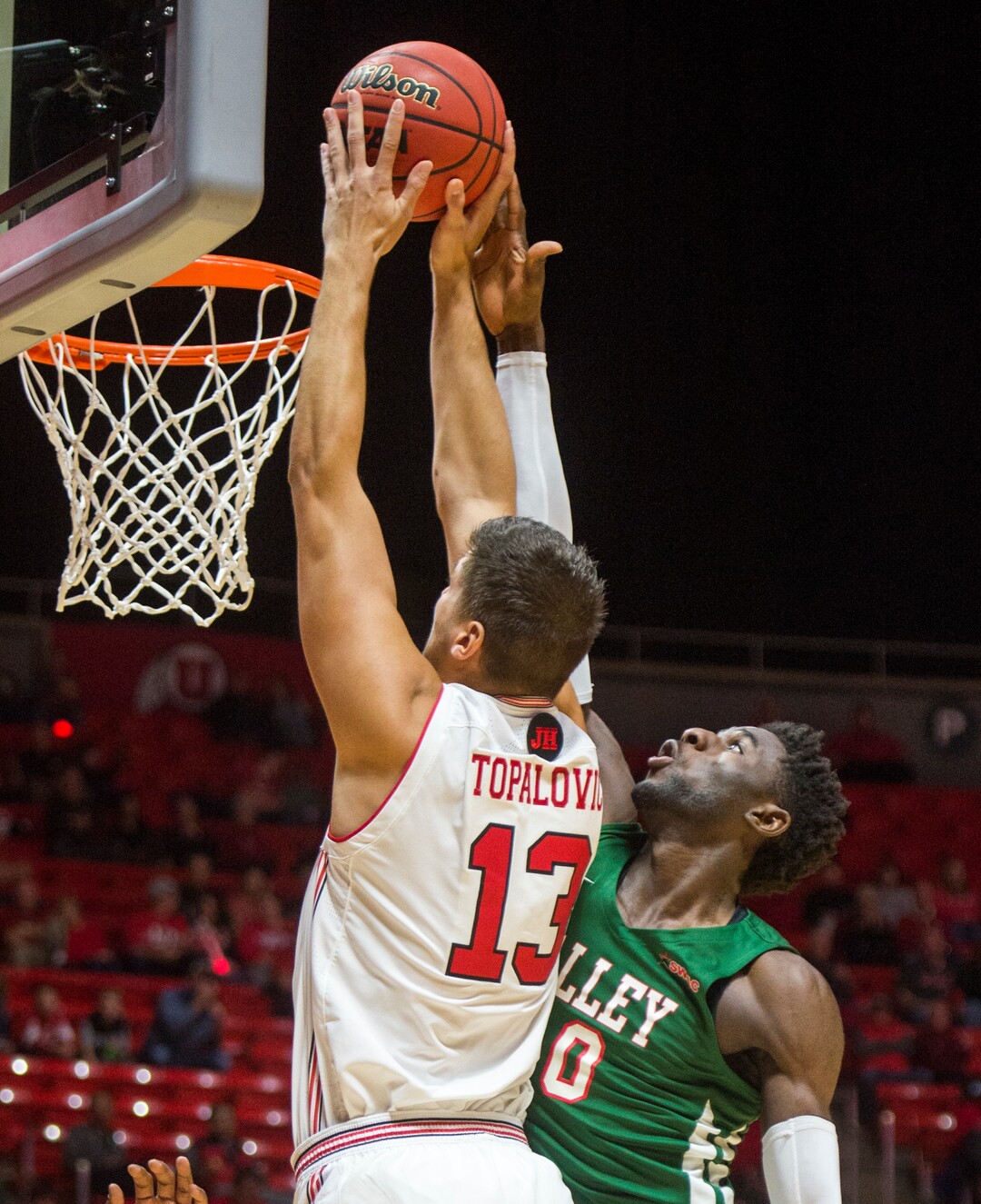 (Rick Egan  |  The Salt Lake Tribune)    Utah Utes forward Novak Topalovic (13) dunks the ball over Mississippi Valley State Delta Devils center Emmanuel Ejeh (10), in basketball action between Utah Utes and Mississippi Valley State Delta Devils at the Jon M. Huntsman Center, Thursday, Nov. 15, 2018.
