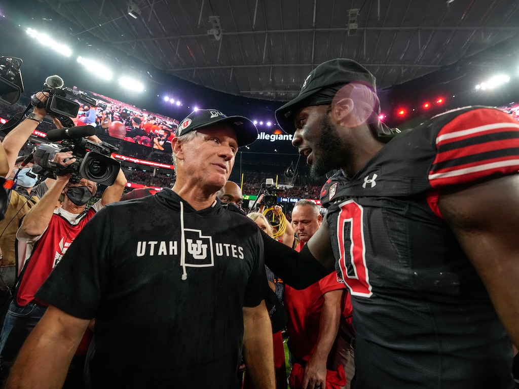 (Leah Hogsten | The Salt Lake Tribune) Utah Utes head coach Kyle Whittingham celebrates the win with Utah Utes linebacker Devin Lloyd (0). The Utes defeated the Oregon Ducks to win the 2021 Pac12 Football Championship title at Allegiant Stadium in Las Vegas, Dec 3, 2021.