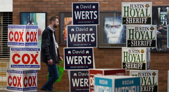 (Leah Hogsten  |  The Salt Lake Tribune) Delegates walk past the prized art work in the commons area and halls of Cottonwood High School as they cast their ballots at the Salt Lake County Republican Party Organizing Convention, Saturday, April 14, 2018.