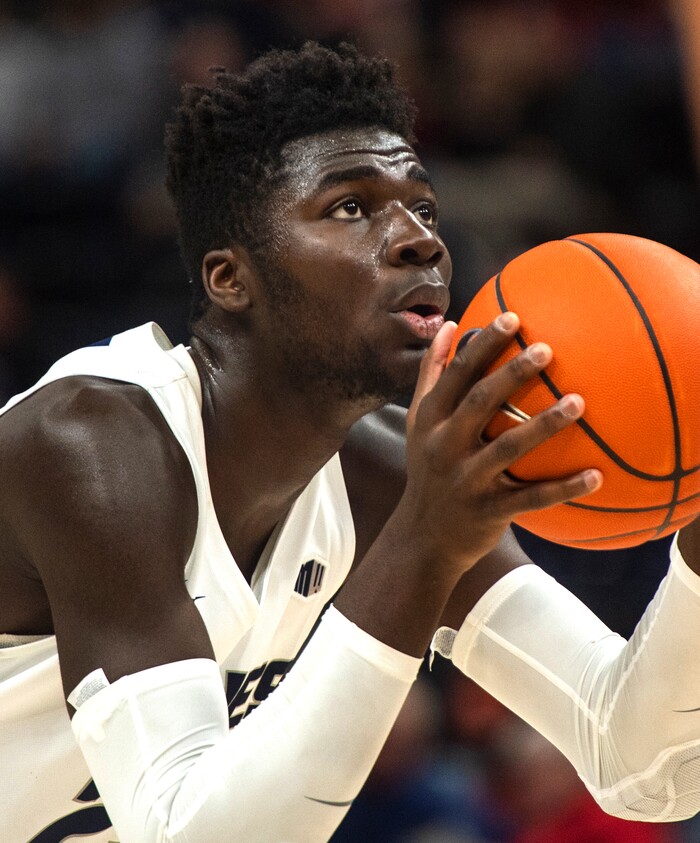 (Rick Egan  |  The Salt Lake Tribune)      Utah State Aggies center Neemias Queta (23) shoots a freethrow, in basketball acton in the Beehive Classic, between against the Utah State Aggies and Weber State Wildcats, a the Vivint Smart Home Arena, Saturday December 8, 2018.

 