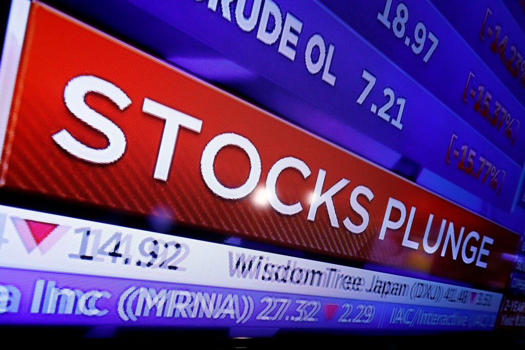 A television screen on the floor of the New York Stock Exchange headlines market activity, Monday, March 9, 2020.  (AP Photo/Richard Drew)