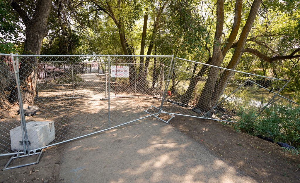 (Chris Samuels | The Salt Lake Tribune) A sign at the Jordan River Trail in Salt Lake City marks a closure due to the Utah State Fair, Thursday, Sept. 5, 2024.