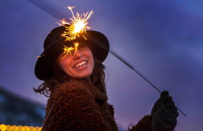 (Rick Egan  |  The Salt Lake Tribune)     Verena Puhm, a director and writer from  from Los Angeles plays with a sparkler at the first-ever Sundance  bonfire, a community gathering on Swede Alley, in Park City, Thursday, Jan. 30, 2020.