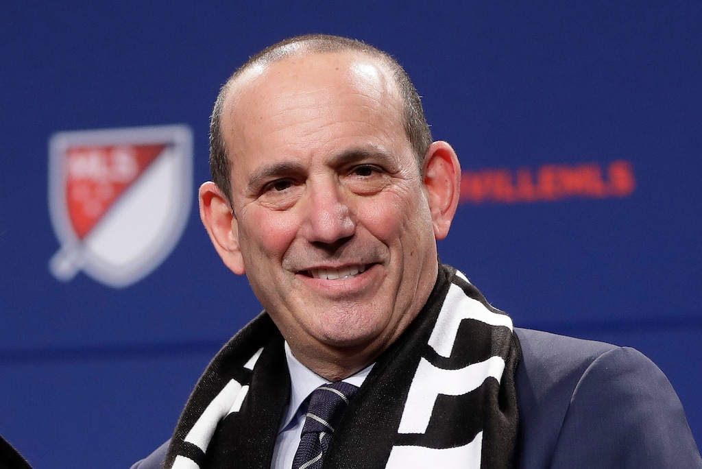 FILE - In this Dec. 20, 2017, file photo, Major League Soccer commissioner Don Garber smiles during a press conference where it was announced that Nashville was awarded an MLS franchise, in Nashville, Tenn. Major League Soccer and Liga MX have joined in a long-term partnership that will launch later this year when reigning MLS Cup champion Toronto hosts a team from Mexico's top league. The match, dubbed the Campeones Cup, is set for Sept. 19 at BMO Field. The partnership announced Tuesday, March 13, 2018, will go beyond that single game to include youth competitions, future All-Star games and other events and initiatives. "We and Liga MX have an opportunity to do something that's really unprecedented in North America," Garber said.  (AP Photo/Mark Humphrey, File)