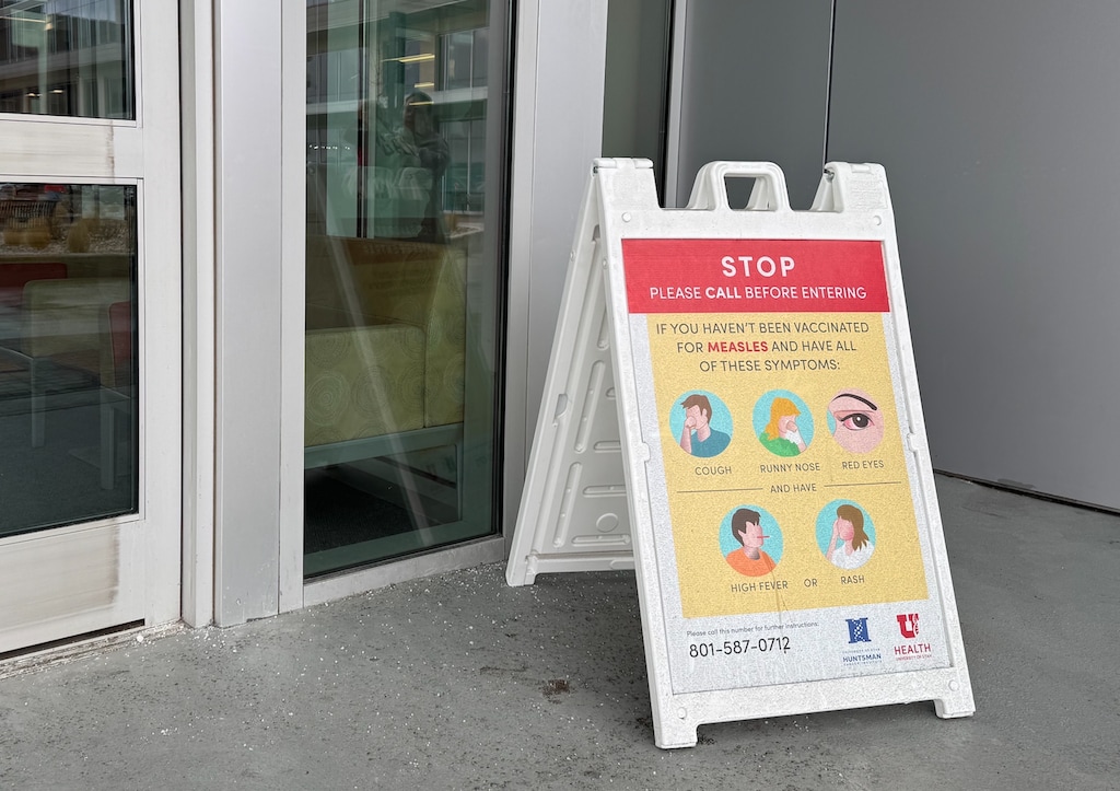(Rachel Crosby | The Salt Lake Tribune) A sign at the Sugar House Health Center in Salt Lake City describes measles symptoms on Monday, March 2, 2026. Measles cases in Utah have risen to 559 since the outbreak began in June 2025.