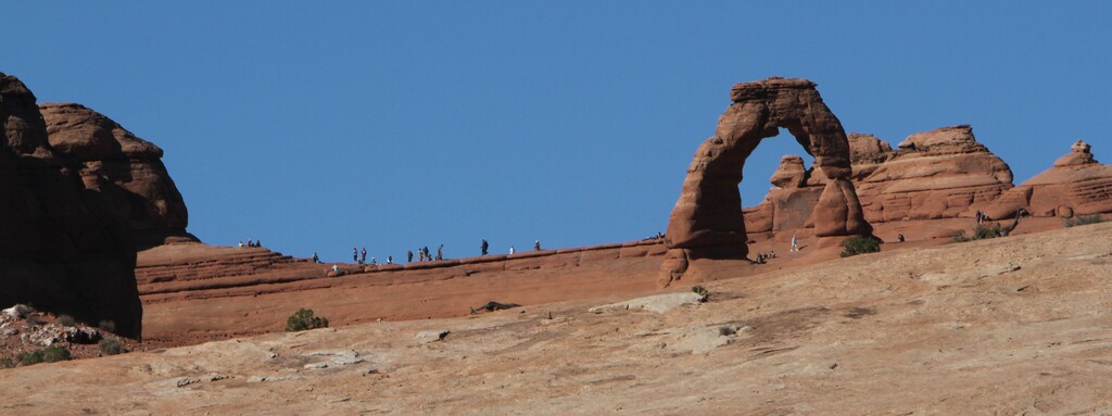 Francisco Kjolseth | The Salt Lake Tribune
Visitors get a close up view of Delicate Arch at Arches National Park in southern Utah recently. The infrastructure of Arches National Park was created based on an annual average visitation of 75,000. The park surpassed 1 million visitors in 2010 and is steadily climbing. Officials at Arches are considering options to reduce the number of cars in the park and a shuttle system is one option. However, it would be expensive and, if visitation numbers keep going up, it could soon be obsolete.
