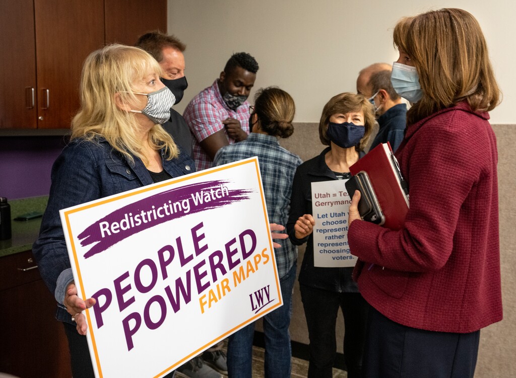 (Leah Hogsten | The Salt Lake Tribune) Sen. Kathleen Riebe, D-Cottonwood Heights, talks to concerned Utah voters Teresa Carlson and Helen Moser with the League of Women Voters about possible partisan gerrymandering of the redrawn redistricting lines on Aug. 19, 2021 at the Millcreek Library.