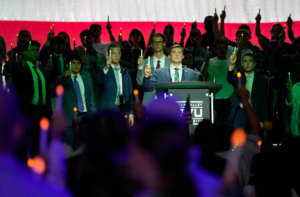 (Francisco Kjolseth | The Salt Lake Tribune) Utah Valley University Student Body President Kyle Cullimore, center, is joined by fellow students for the conclusion of a vigil on Friday, Sept. 19, 2025, at the UCCU Center following the recent shooting death on campus of Charlie Kirk, conservative commentator and founder of Turning Point USA.