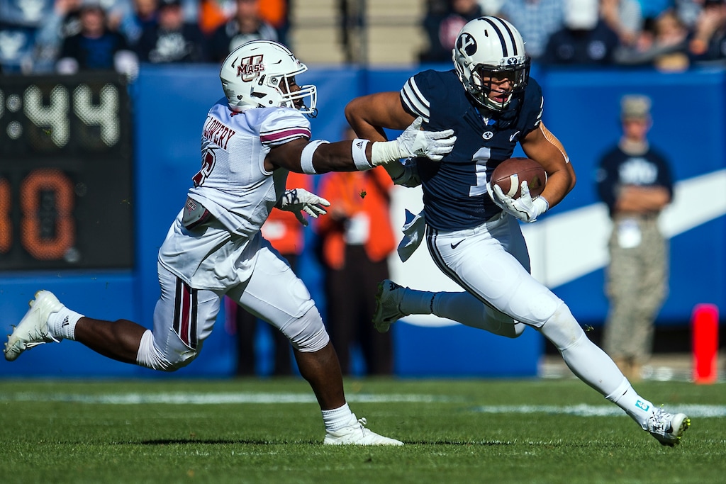 Chris Detrick  |  The Salt Lake TribuneBrigham Young Cougars wide receiver Moroni Laulu-Pututau (1) runs past Massachusetts Minutemen safety Tedrick Lowery (6) during the game at LaVell Edwards Stadium Saturday November 19, 2016. 