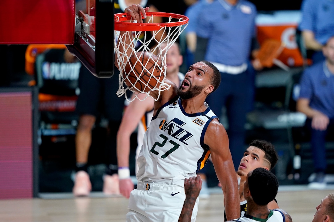 (Ashley Landis | AP) Utah Jazz's Rudy Gobert (27) dunks against the Denver Nuggets during the first half of an NBA basketball first round playoff game, Wednesday, Aug. 19, 2020, in Lake Buena Vista, Fla.