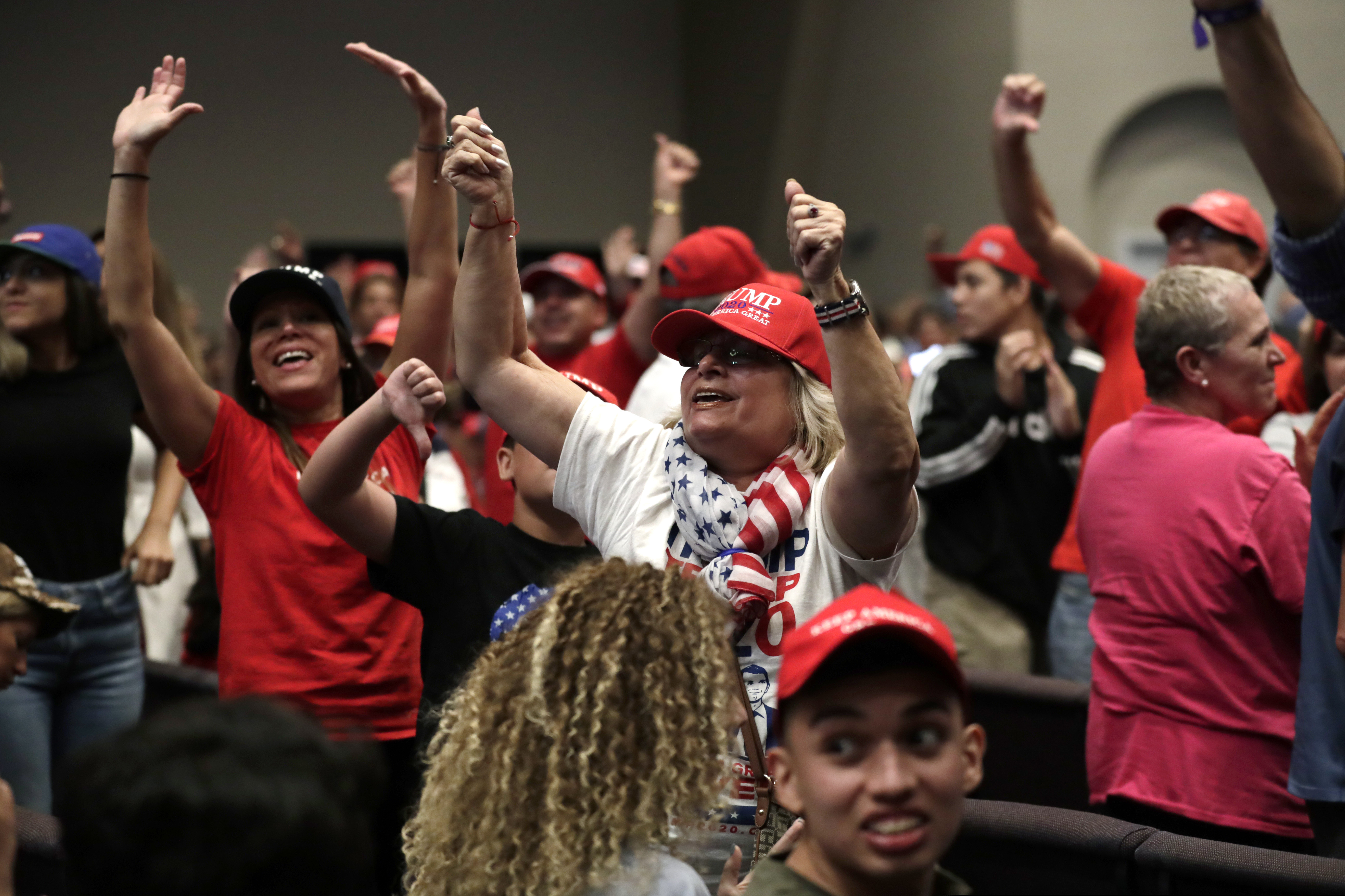(Lynne Sladky | The AP)Supporters of President Donald Trump turn and yell toward the news media during a rally for evangelical supporters in January 2020 in Miami.