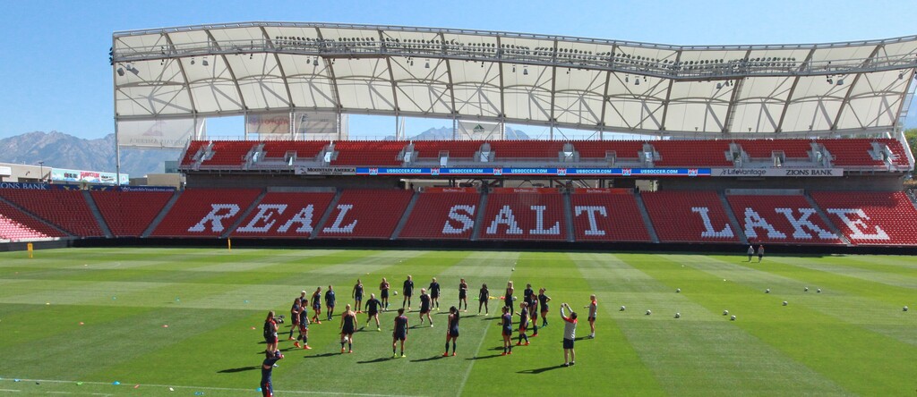 FILE - In this Sept. 12, 2014 file photo, members of the U.S. Women's National team warm up during practice at Rio Tinto Stadium in Sandy, Utah. Utah's professional soccer team, Real Salt Lake, has saved about $5 million over the last five years after its owner quietly persuaded the county to cut the team's stadium property tax assessment by about half. (AP Photo/Rick Bowmer, File)