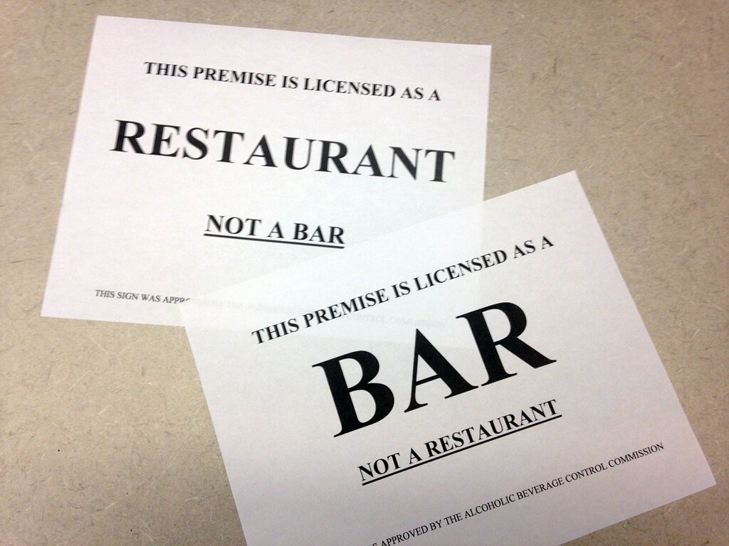 New signs like these are designed to help diners differentiate between bars and restaurants that serve alcohol.