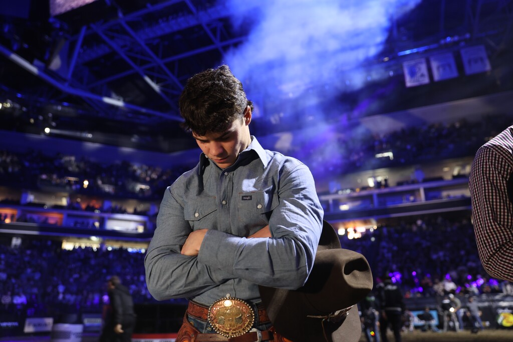 (Andy Watson|Bull Stock Media) Kade Madsen says a private prayer before competing at the Sacramento Unleash The Beast PBR. 