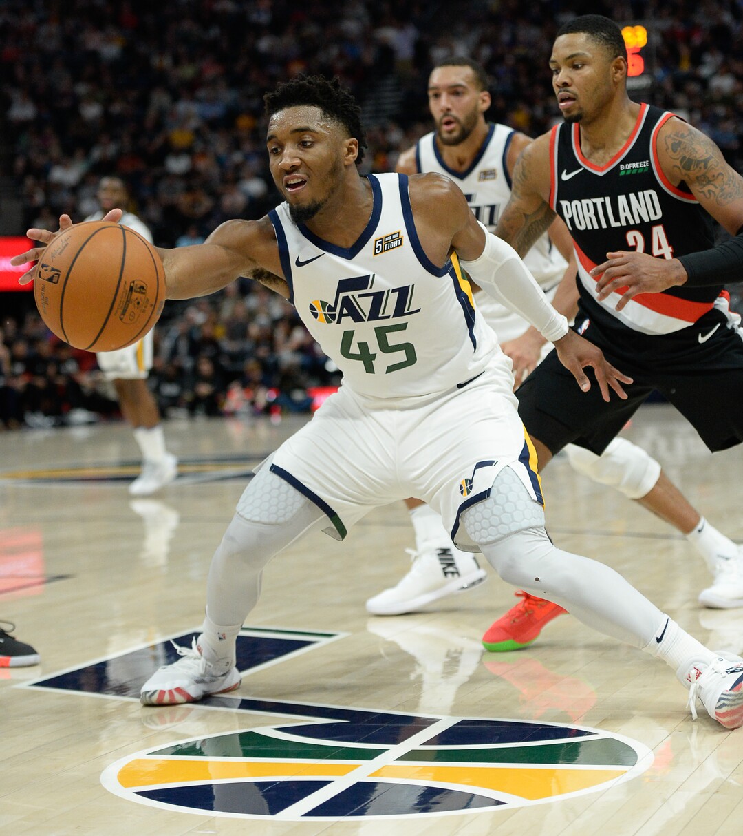 (Francisco Kjolseth  |  The Salt Lake Tribune)  Utah Jazz guard Donovan Mitchell (45) reaches out for a ball as the Utah Jazz host the Portland Trailblazers in their NBA basketball game at Vivint Smart Home Arena in Salt Lake City on Wed. Oct. 16, 2019.