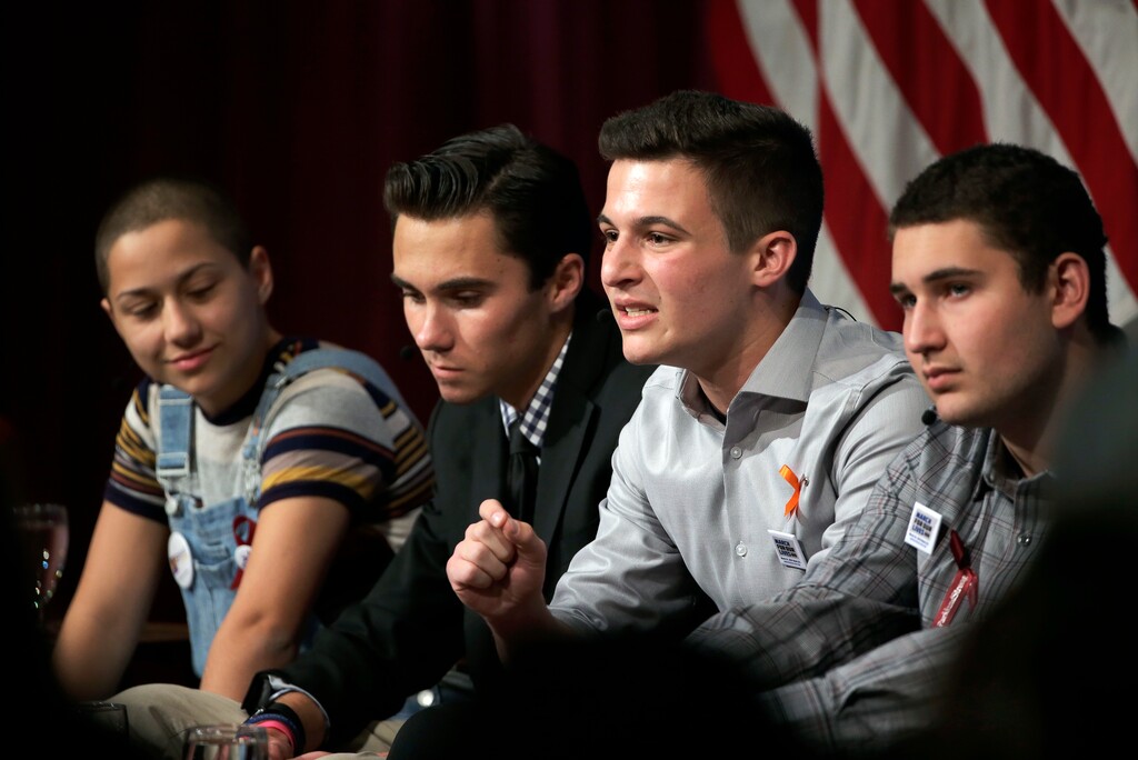 (Steven Senne | The Associated Press) Marjory Stoneman Douglas High School students, and mass shooting survivors, from left, Emma Gonzalez, David Hogg, Cameron Kasky and Alex Wind participate in a panel discussion about guns, Tuesday, March 20, 2018, at Harvard Kennedy School's Institute of Politics, in Cambridge, Mass. The Feb. 14, 2018, attack in Florida killed 17 people, 14 of them students. The students have become vocal advocates for stricter gun laws.