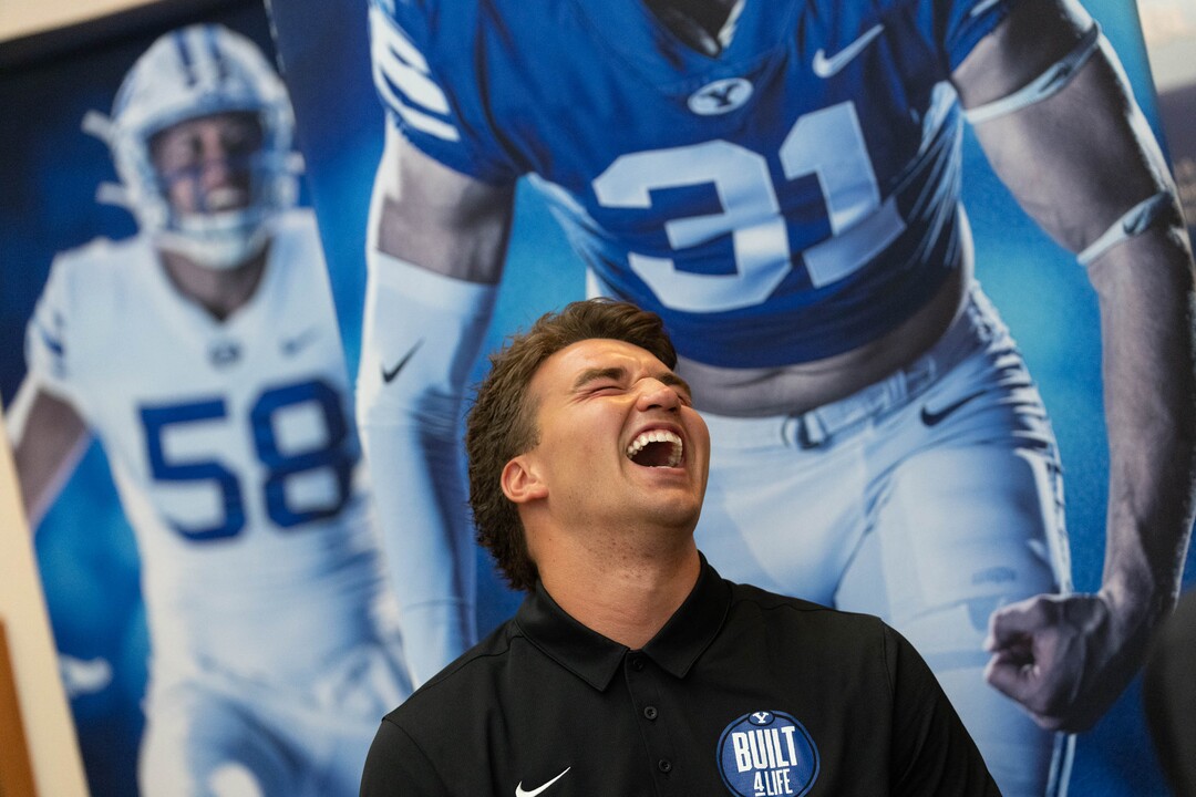 (Francisco Kjolseth | The Salt Lake Tribune) Tight end Dallin Holker busts up during a print media interview as BYU football coaches, players and staff participate in BYU football media day in the BYU Broadcasting Building in Provo on Thursday, June 17, 2021.