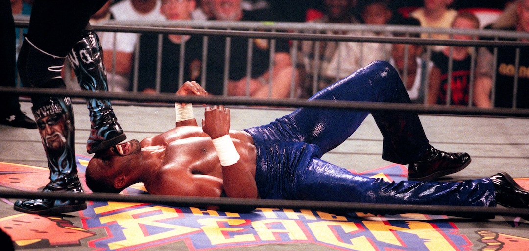 (Trent Nelson | The Salt Lake Tribune)  Karl Malone wrestles Hollywood Hulk Hogan at WCW's Bash at the Beach in San Diego. July 12, 1998.