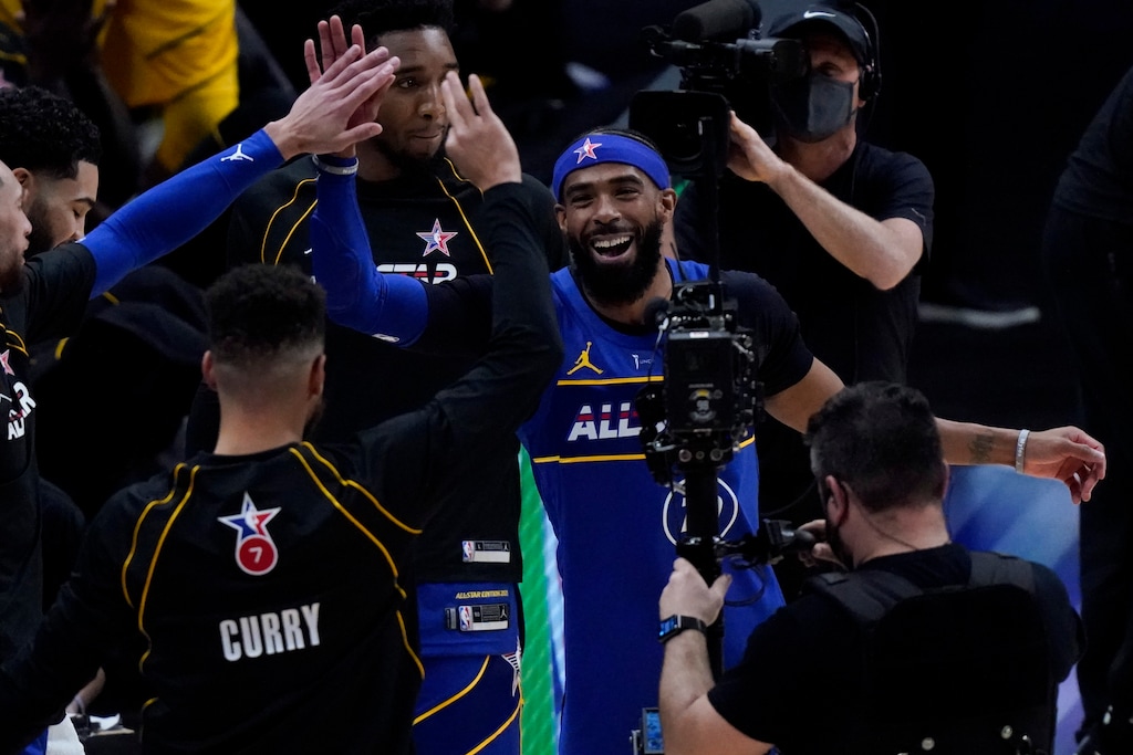 (Brynn Anderson | AP) Golden State Warriors guard Stephen Curry and Utah Jazz guard Mike Conley celebrate during the first half of basketball's NBA All-Star Game in Atlanta, Sunday, March 7, 2021.