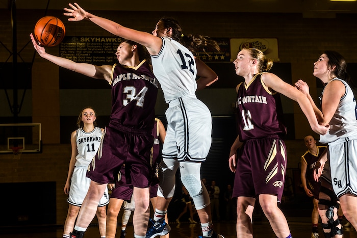 Chris Detrick  |  The Salt Lake TribuneMaple Mountain's MiKayla Hubbard (34) and Salem Hills' Lauren Gustin (12) go for a rebound during the game at Salem Hills High School Tuesday January 12, 2016. Salem Hills won the game 82-63.