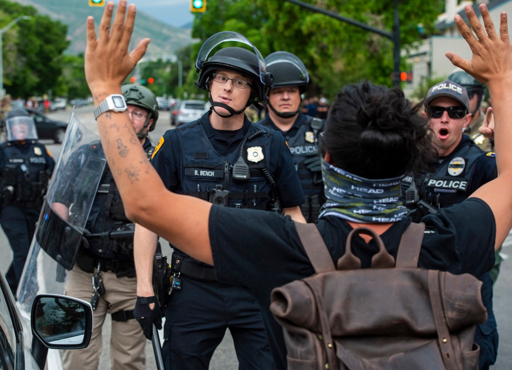 (Rick Egan | The Salt Lake Tribune) Police threaten to arrest a protester as they push crowds down 300 South on Saturday, May 30, 2020.