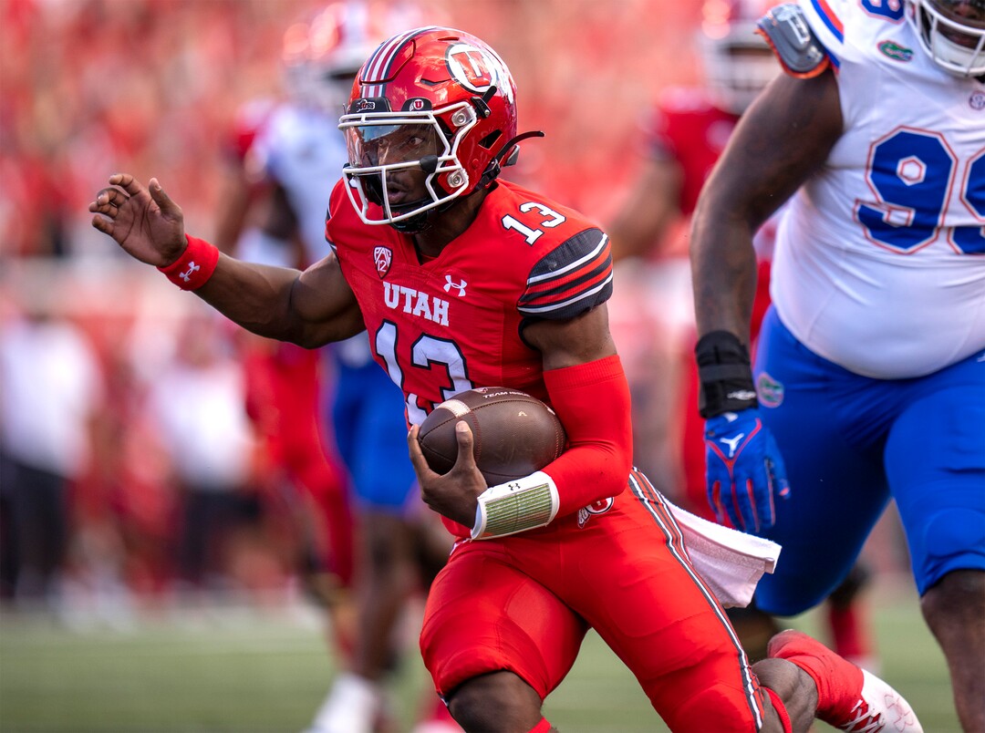 (Rick Egan | The Salt Lake Tribune) Utah Utes quarterback Nate Johnson (13) runs for a touchdown in football action between the Utah Utes and the Florida Gators at Rice-Eccles Stadium on Thursday, Aug. 31, 2023.
