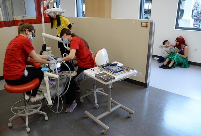 (Francisco Kjolseth  |  The Salt Lake Tribune) Whitney Gillman dressed as Ariel reads a dental related children's book to a young patient before they get no-cost dental work at the University of Utah dental school on Saturday, Feb. 29, 2020, as part of the American Dental AssociationÕs ÒGive Kids a SmileÓ program.