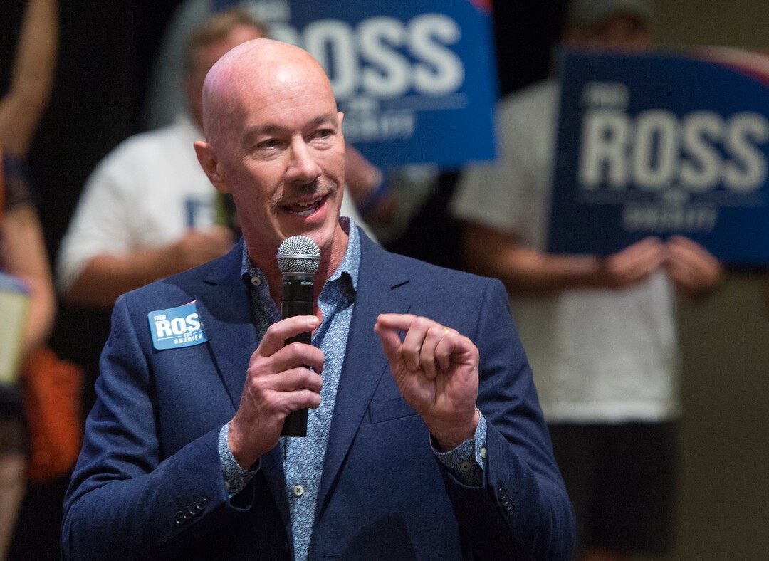(Rick Egan  |  The Salt Lake Tribune)  Former Salt Lake City police chief Chris Burbank, endorses candidate Fred Ross, before the vote, for the Salt Lake County sheriff. Saturday, August 12, 2017.
