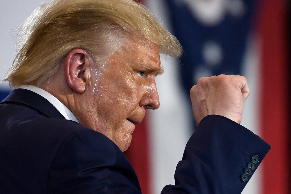 (Susan Walsh | AP file photo)  President Donald Trump pumps his fist as he finishes speaking during an event at the Whirlpool Corporation facility in Clyde, Ohio, Thursday, Aug. 6, 2020.