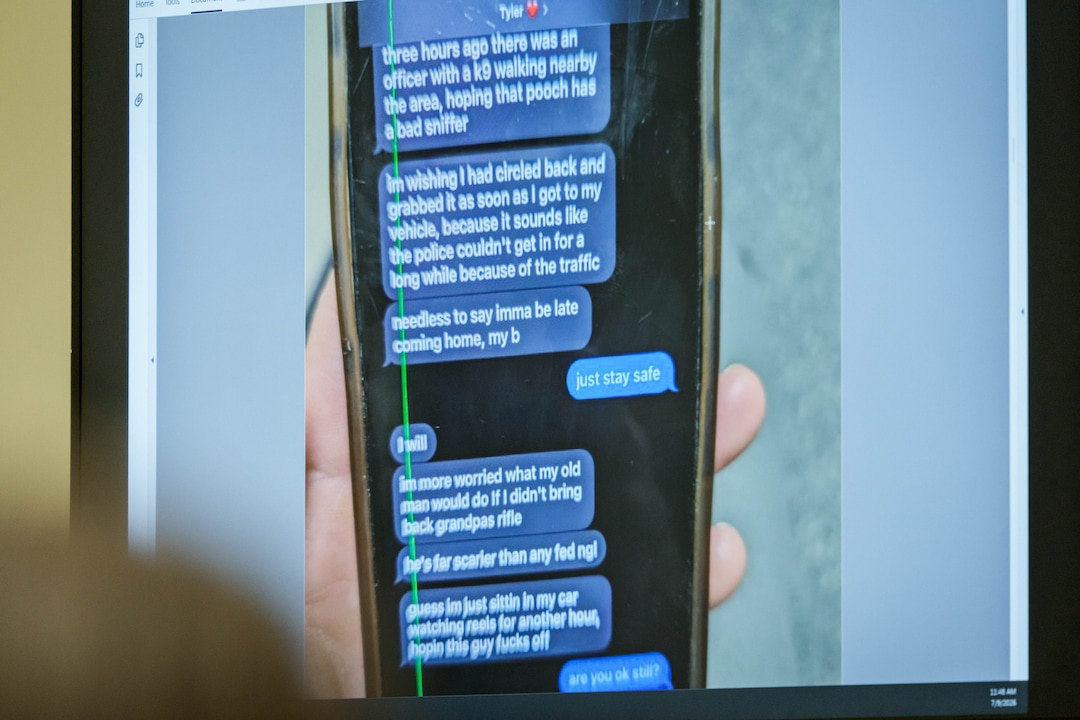 (Spenser Heaps | Pool) A photograph which prosecutors say shows a text message exchange between Tyler Robinson, who is accused in the fatal shooting of Charlie Kirk, and Robinson’s roommate and romantic partner Lance Twiggs, is shown during a preliminary hearing at the Fourth District Courthouse in Provo, Thursday, July 9, 2026.