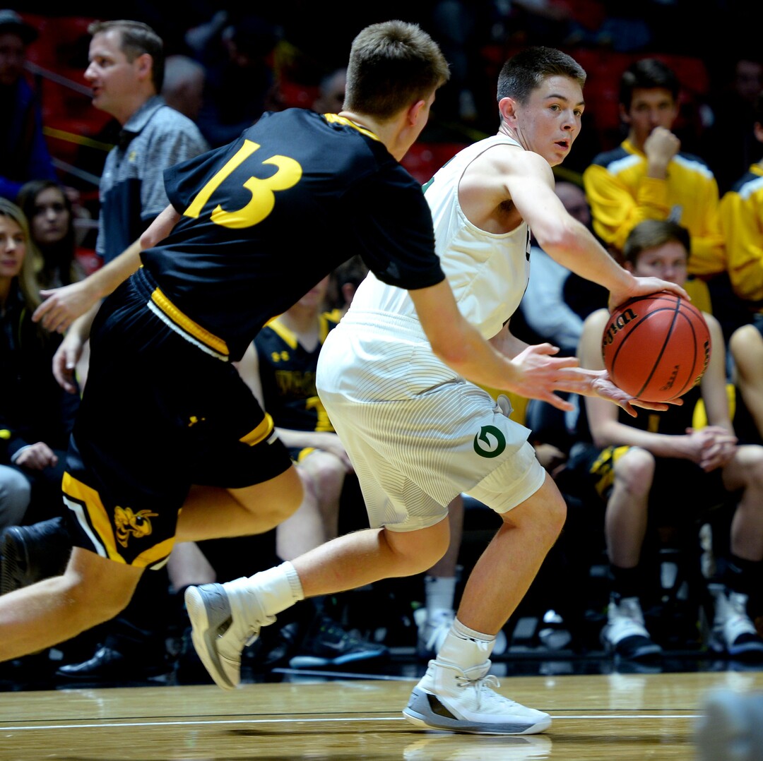 Steve Griffin  |  The Salt Lake TribuneOlympus guard Rylan Jones fires a pass during during 4A playoff game against Wasatch at the Huntsman Center in Salt Lake City Tuesday February 28, 2017.