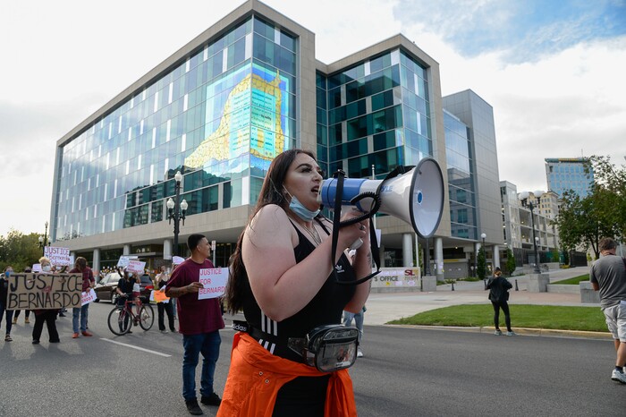 (Francisco Kjolseth  |  The Salt Lake Tribune) Sofia Alcala leads the crowd as they chant during a Rally for Bernardo Palacios, in front of the Salt Lake County District Attorney's office and block traffic along 500 S. on Thursday, June 18, 2020.