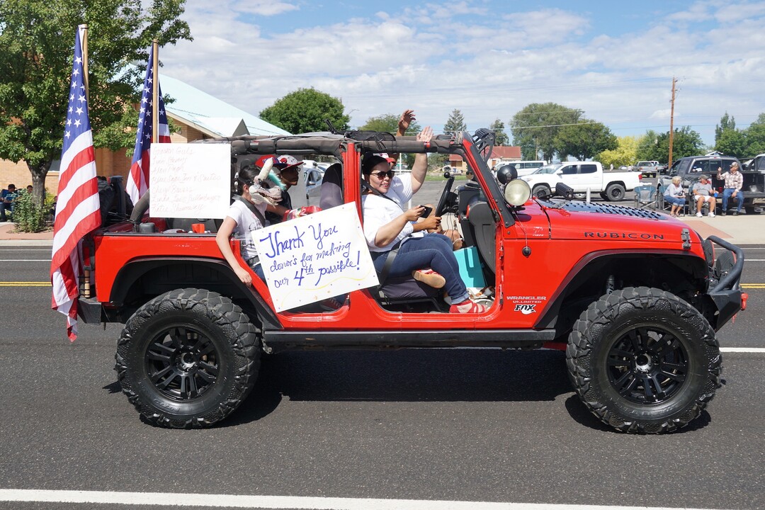 (Zak Podmore | The Salt Lake Tribune) Toniee Lewis, who helped organize a Fourth of July event after the city canceled the planned celebration, leads the parade down Main Street in Blanding with her family.