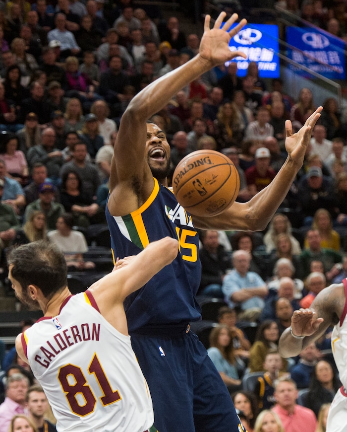 (Rick Egan  |  The Salt Lake Tribune)   Utah Jazz forward Derrick Favors (15) collides with Cleveland Cavaliers guard Jose Calderon (81), in NBA action Utah Jazz vs Cleveland Cavaliers, in Salt Lake City,  Saturday, December 30, 2017.


