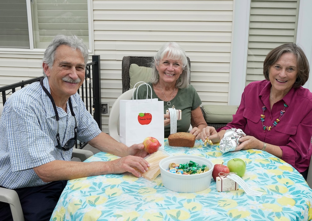 (Rick Egan | The Salt Lake Tribune) Rob Mayer, Betsy Smith and Carol Blackwell from Chavurah B'Yachad (Reconstructionist) prepare gift packets Saturday, Aug. 21, 2021, for their members to mark Rosh Hashana.