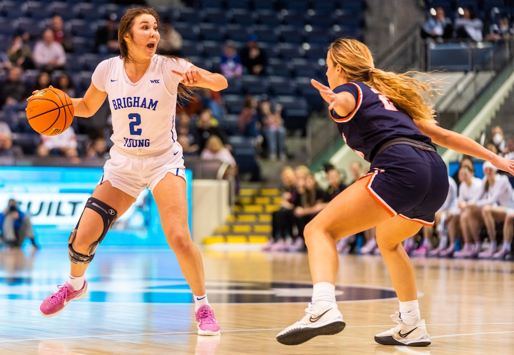 (Rick Egan | The Salt Lake Tribune) BYU guard Shaylee Gonzales (2)runs the offense for the Cougars, as Pepperdine Waves forward Kendyl Carson (22) defends, in women's basketball action between the BYU Cougars and the Pepperdine Waves, at the Marriott Center in Provo, on Thursday, Feb. 10, 2022. Judkins scored his 450th win tonight.