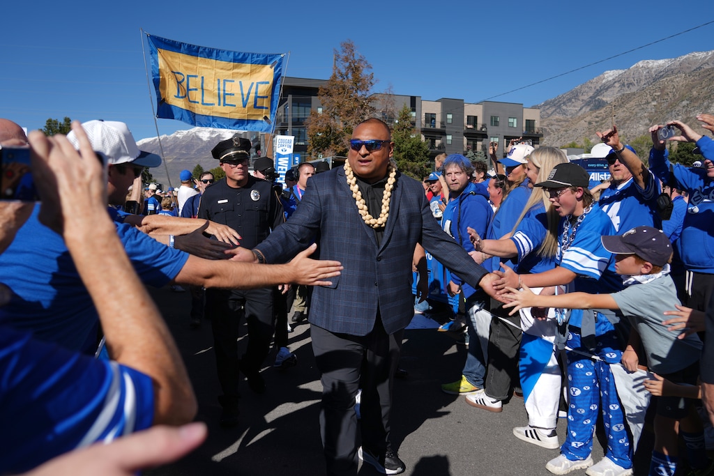 (George Frey | Special to The Tribune) BYU Cougars head coach Kalani Sitake greets fans before the start of a game against the Notre Dame Fighting Irish at LaVell Edwards Stadium on October 17, 2026.
