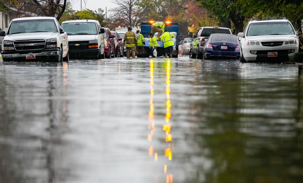 (Francisco Kjolseth | The Salt Lake Tribune) Extensive flooding causes damage to dozens of homes near 800 North and Sir Philip Drive, just east of Interstate 215, on Saturday, Oct. 4, 2024.